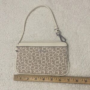 Calvin Klein Cream and Tan Monogram Wristlet
